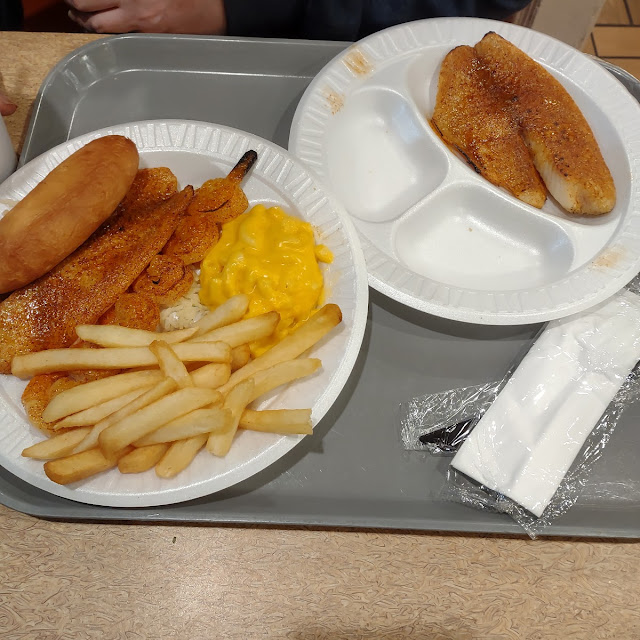 Grilled Fish and Shrimp with Fries and Another Starch with an Extra Piece of Fish