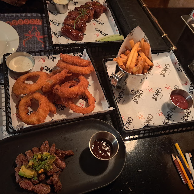 Chicken Wings Angus Beef Onion Rings and French Fries
