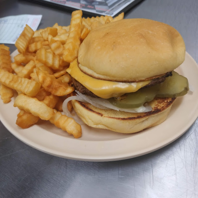 Cheeseburger with Pickle and Onion with Fries