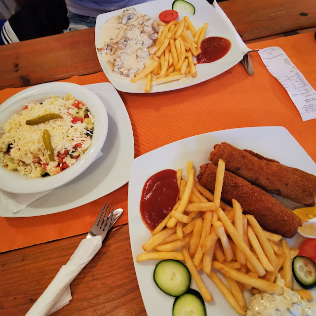 Fried Pancakes with French Fries Salad Chicken with a Topping of Mushrooms Also with French Fries