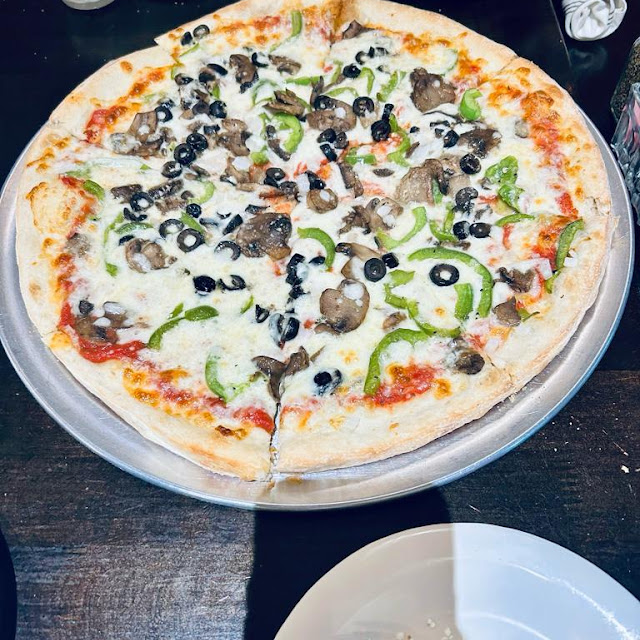 Whole Pizza and Iced Tea