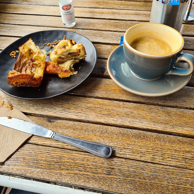 Warm Cinnamon Scroll and Coffee