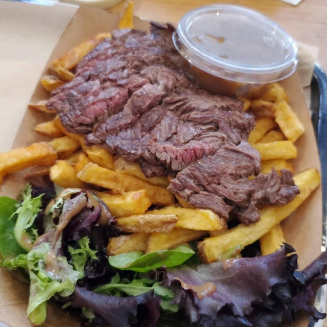 Medium-Well Steak over Crispy Fries w a Side Salad and Carmelized Onions