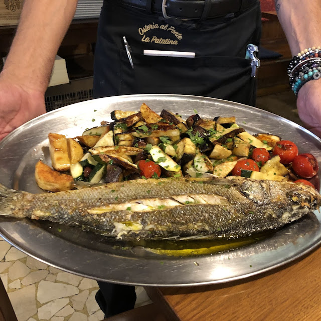 II Pescato Del Giorno Al Forno Con Patate Olive Capperi E Ciliegini