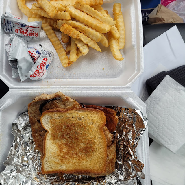 Grilled Pork Chop with Sautéed Onion Sandwich