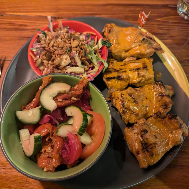 Chicken Thighs Chips and Portuguese Tomato Salad and Rainbow Slaw