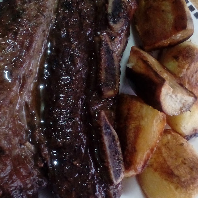 Asado de Tira Con Papas Al Horno
