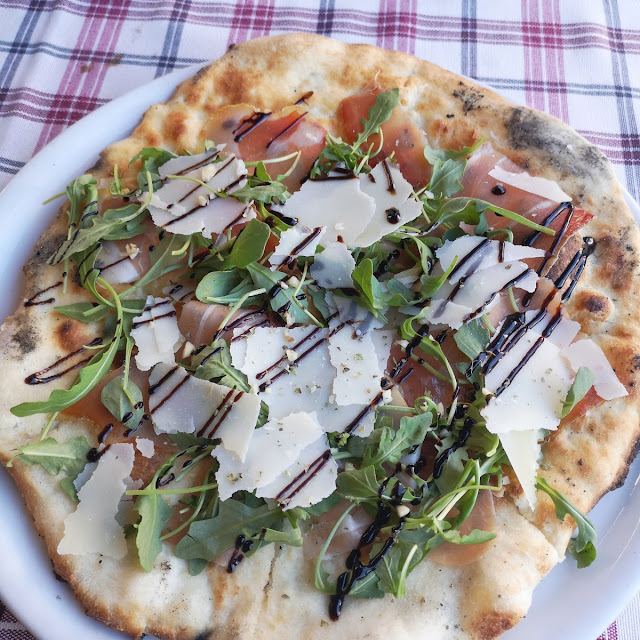 Pizza with Rucola Serrano Ham and Parmesan