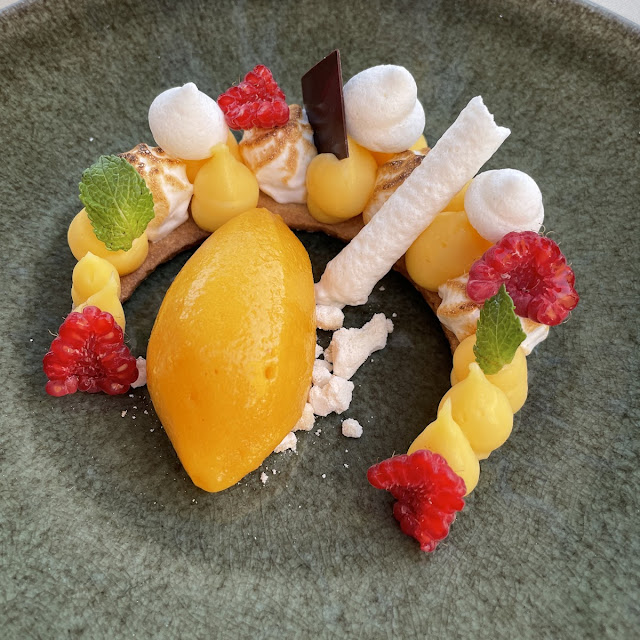 Meringue Shell with Exotic Fruits and Double Cream from Gruyère