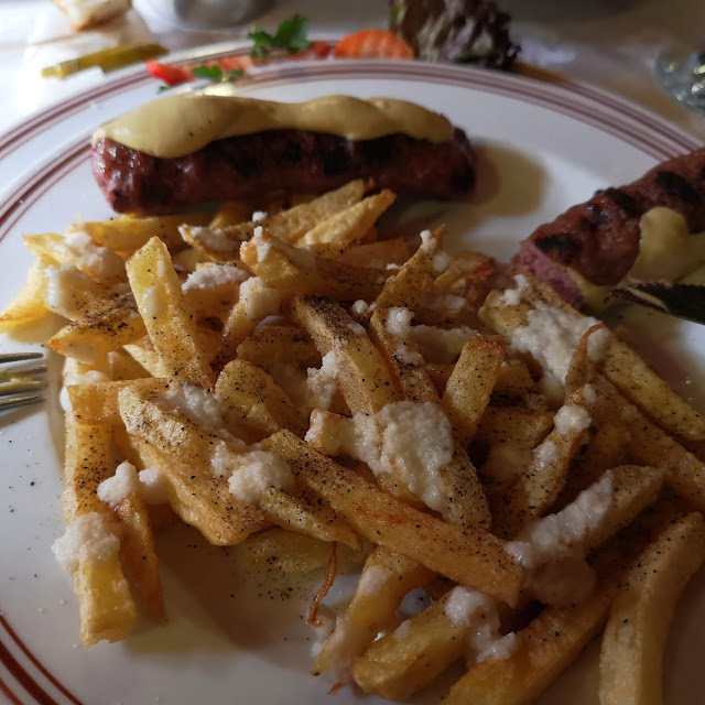 French Fries with Garlic and Mici Grilled Rolled Grinded Mixed Meat with Mustard