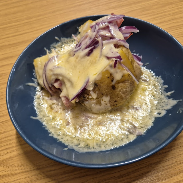 Jacket Potato with Cheese Ham and Red Onion